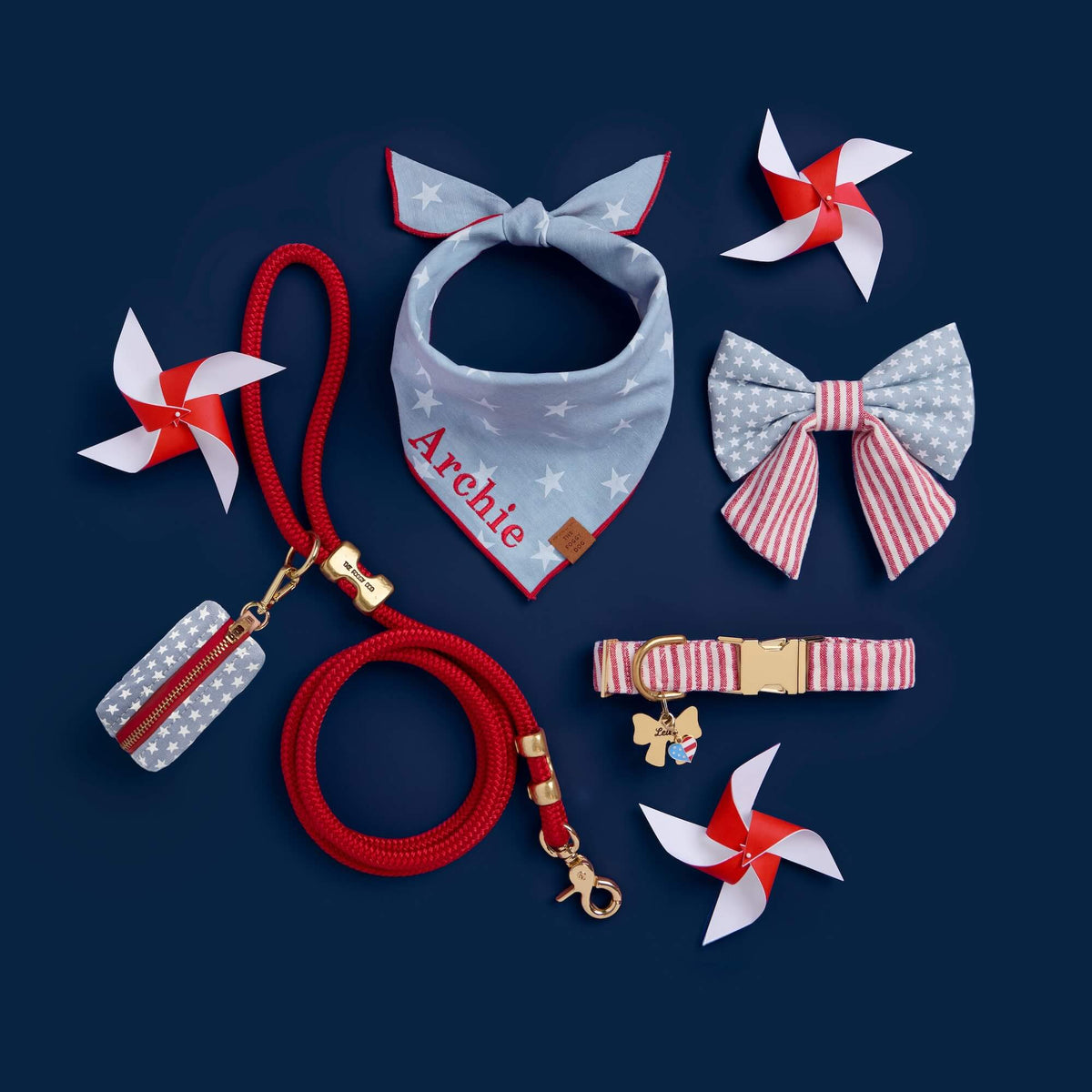 Liberty Waste Bag Holder, Ruby Marine Rope Dog Leash, Liberty Dog Bandana, Red Stripe Dog Collar, Stars and Stripes Lady Bow Collar, I Heart America Collar Charm, and Lady Bow Pet ID Tag, from The Foggy Dog