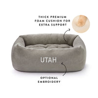 Pebble Gray Flannel Bolster Bed from The Foggy Dog